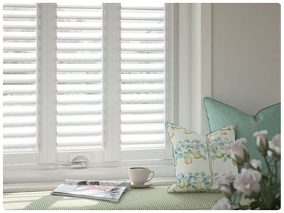 Modern, neutral living room featuring our no-drill shutters