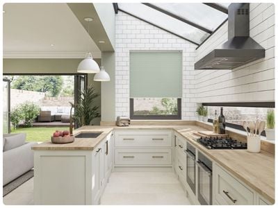 Modern living room with stick-on blinds for patio doors.