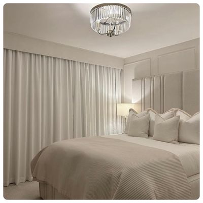 Black pleated blinds on bifold doors