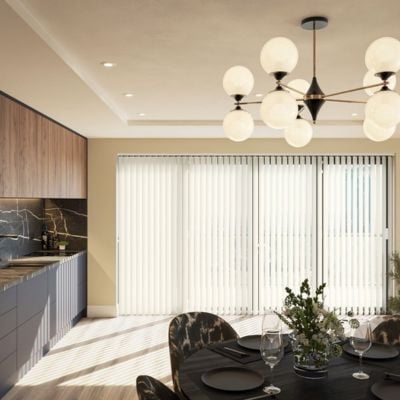 Cream vertical blinds covering bifold doors in a kitchen